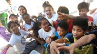 Kids receiving goods from the Maliyaa Foundation